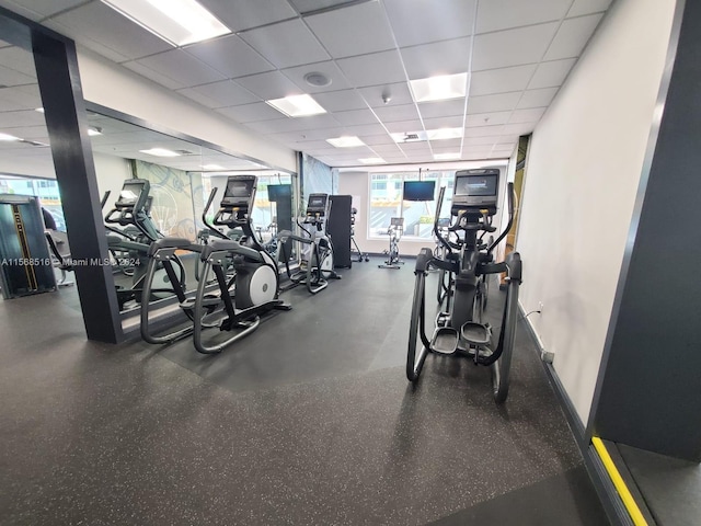 workout area featuring a paneled ceiling