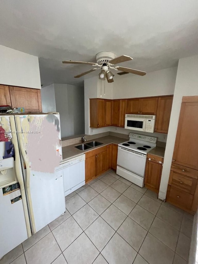 kitchen with sink, white appliances, ceiling fan, and light tile floors