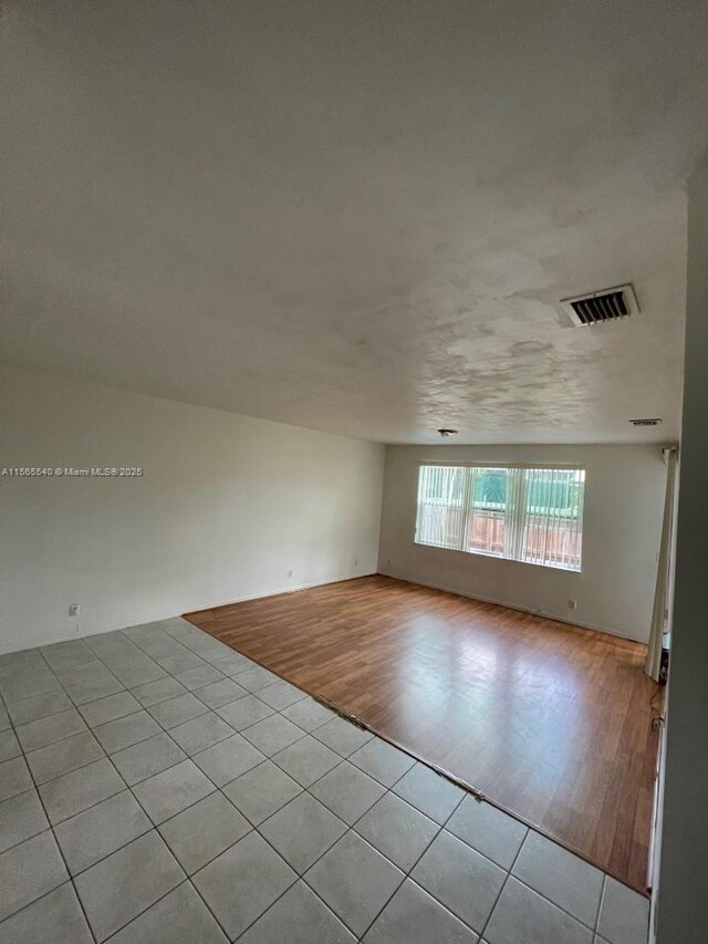 unfurnished room featuring light wood-type flooring