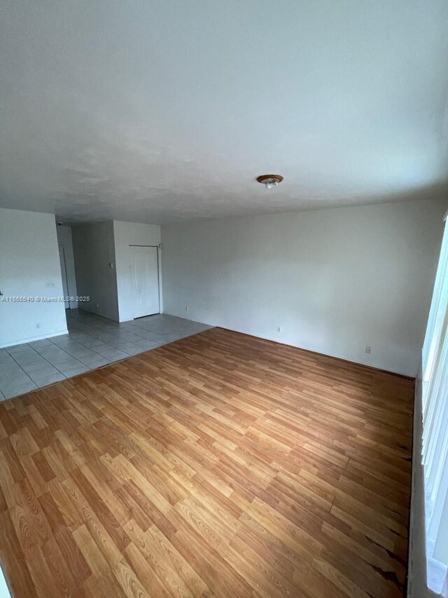 spare room with light wood-type flooring