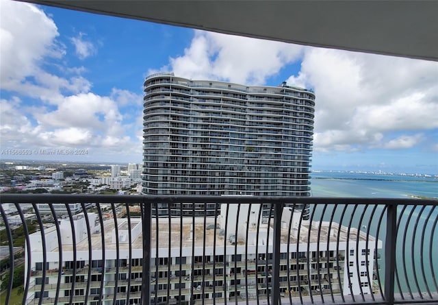 balcony featuring a water view