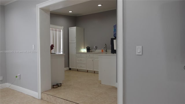 bathroom with tile floors and vanity