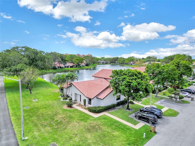 birds eye view of property featuring a water view