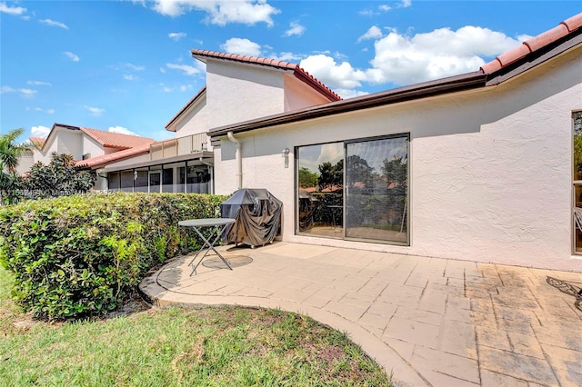 rear view of house featuring a patio