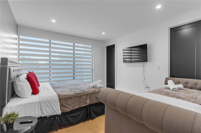 bedroom with light wood-type flooring