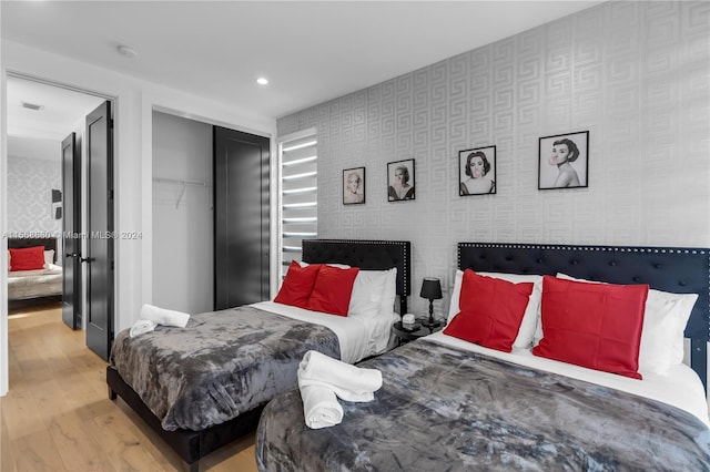 bedroom with a closet and light wood-type flooring