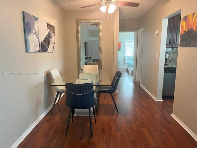 dining room featuring ceiling fan, dark hardwood / wood-style flooring, and a textured ceiling