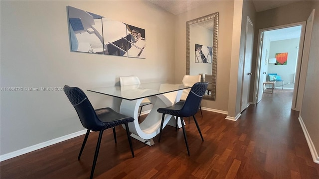 dining room featuring dark hardwood / wood-style flooring