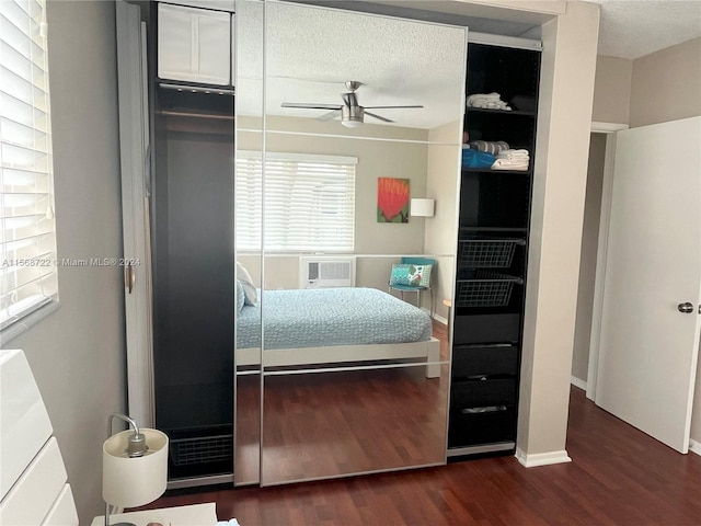 bedroom with a closet, dark hardwood / wood-style flooring, and ceiling fan