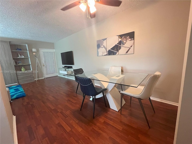 dining room featuring ceiling fan, dark hardwood / wood-style floors, and a textured ceiling