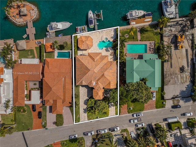 birds eye view of property featuring a water view