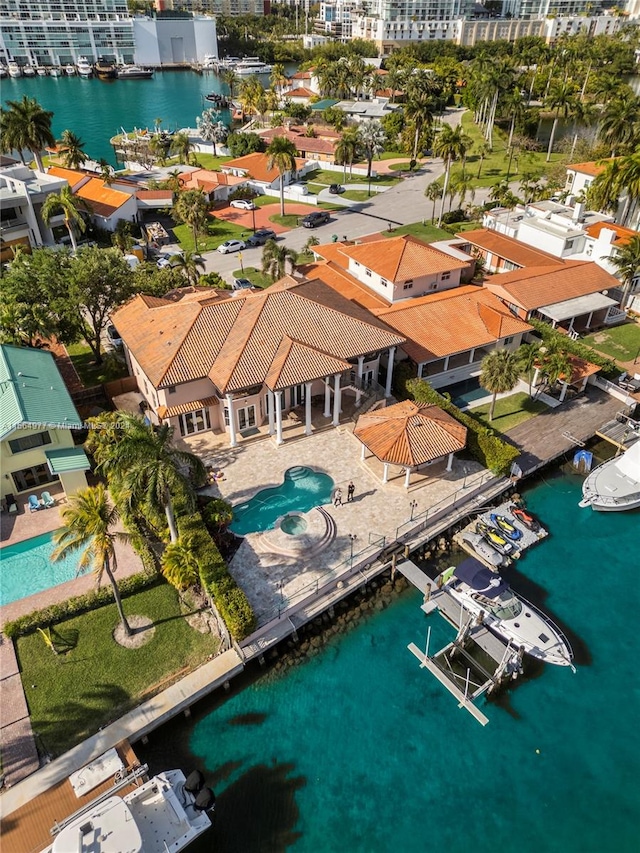 birds eye view of property with a water view