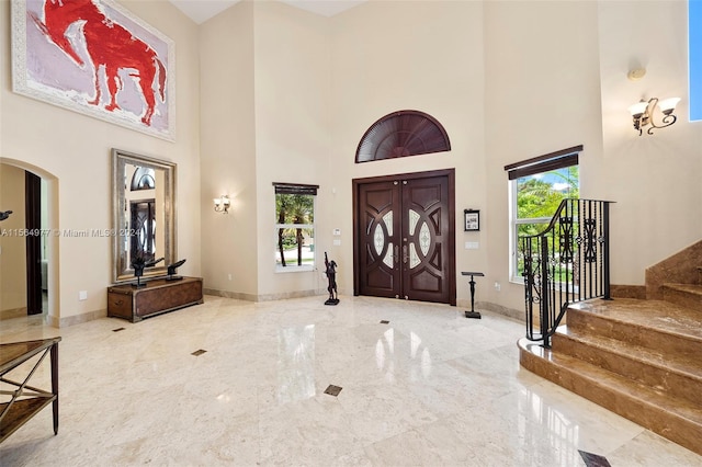 entryway with a high ceiling