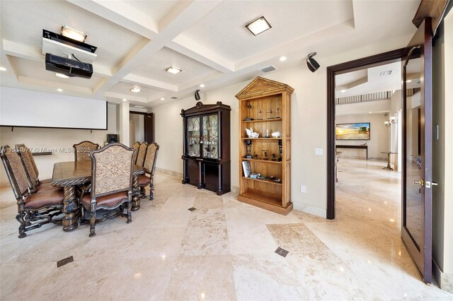 dining room featuring beam ceiling and coffered ceiling