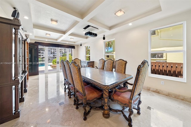 dining area with french doors, coffered ceiling, and beam ceiling