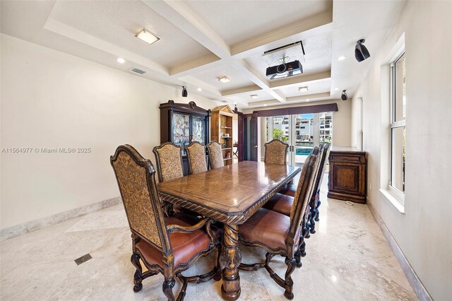 dining area featuring beam ceiling, french doors, and coffered ceiling