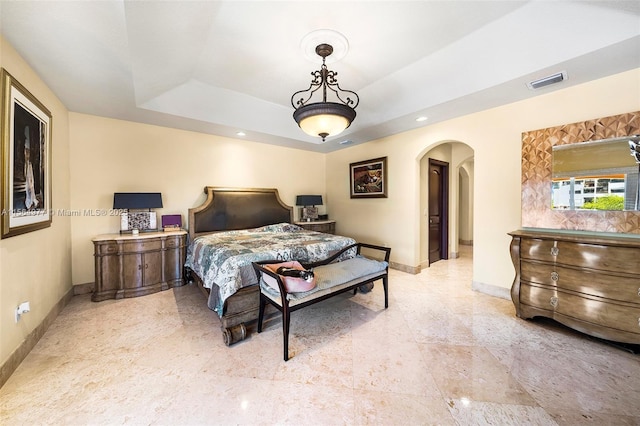 bedroom with a raised ceiling