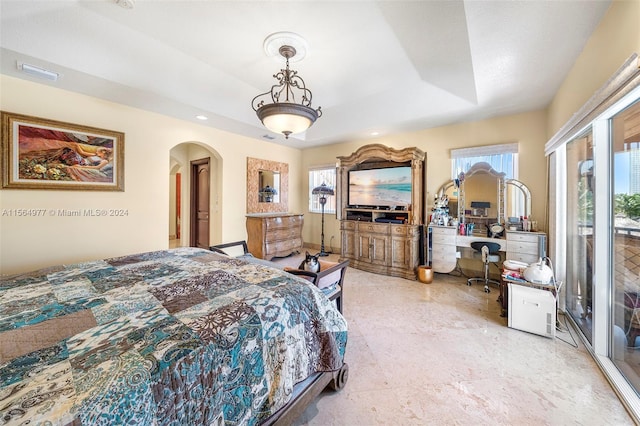 bedroom featuring a raised ceiling