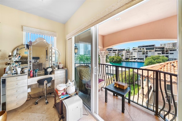 balcony featuring a water view