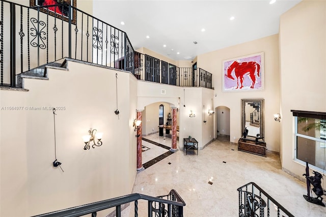 interior space with a towering ceiling