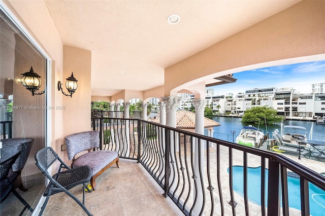 balcony featuring a water view