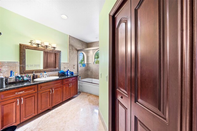 bathroom with vanity and independent shower and bath