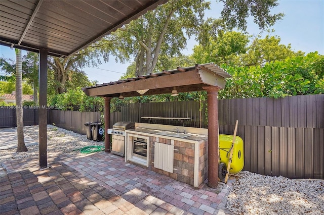 view of patio / terrace with area for grilling, exterior kitchen, and sink