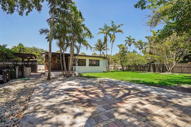 rear view of house with a yard