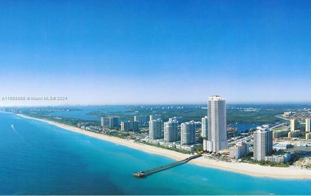 drone / aerial view with a view of the beach and a water view