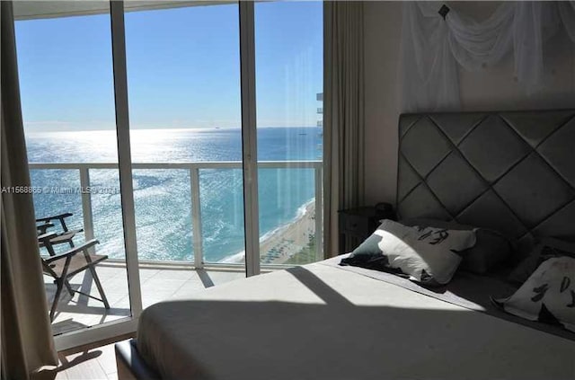 bedroom featuring a water view