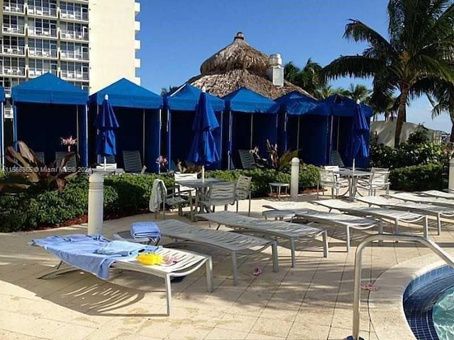 view of property's community featuring a patio area