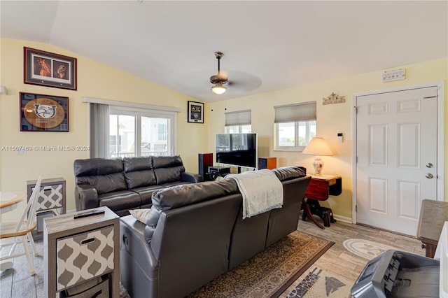 living room with vaulted ceiling, ceiling fan, and light hardwood / wood-style floors