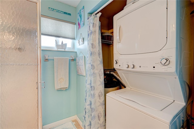 laundry room featuring stacked washer / dryer