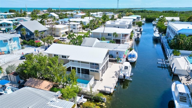 drone / aerial view with a water view