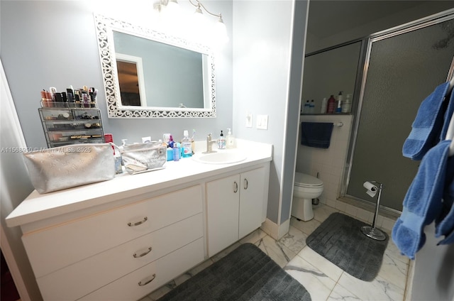 bathroom with vanity, toilet, and walk in shower