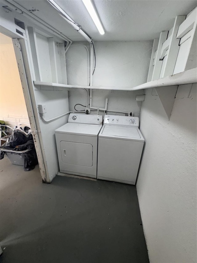 laundry room with washer hookup and washer and clothes dryer