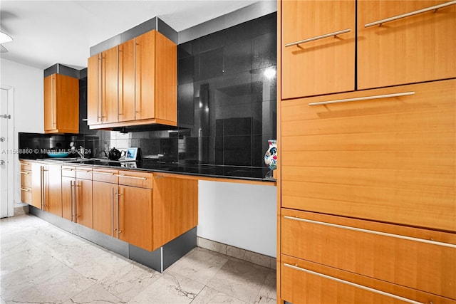 kitchen with decorative backsplash and sink