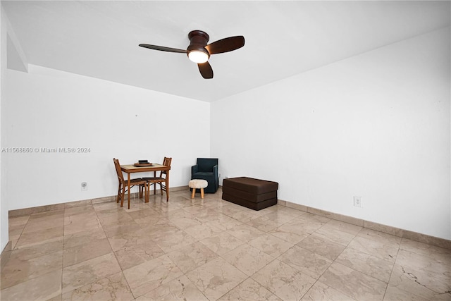 living area with ceiling fan