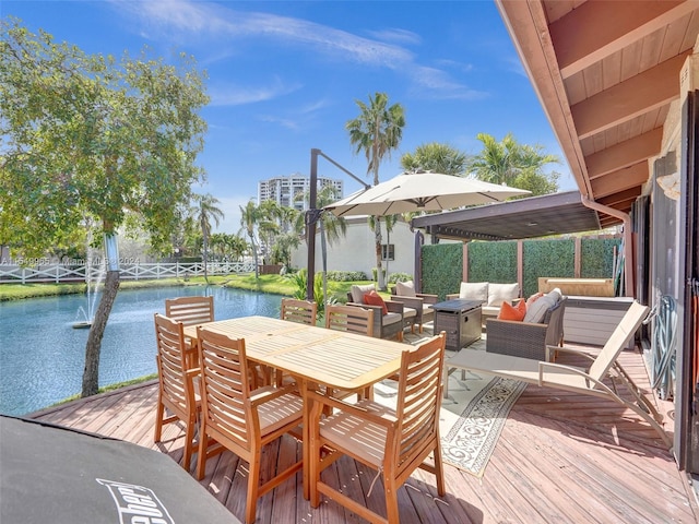 wooden deck featuring an outdoor hangout area and a water view