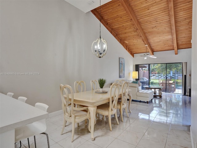 dining space with ceiling fan with notable chandelier, wooden ceiling, beamed ceiling, and light tile floors