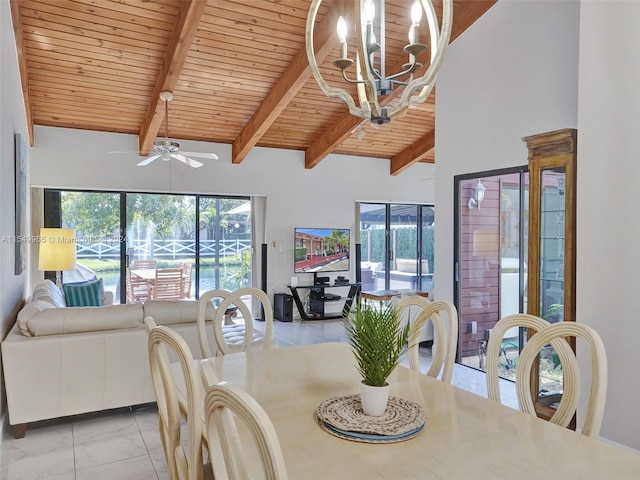 tiled dining space with ceiling fan with notable chandelier, vaulted ceiling with beams, and wooden ceiling