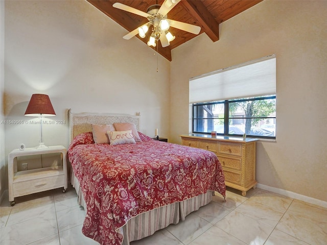 tiled bedroom with wood ceiling, ceiling fan, and vaulted ceiling with beams