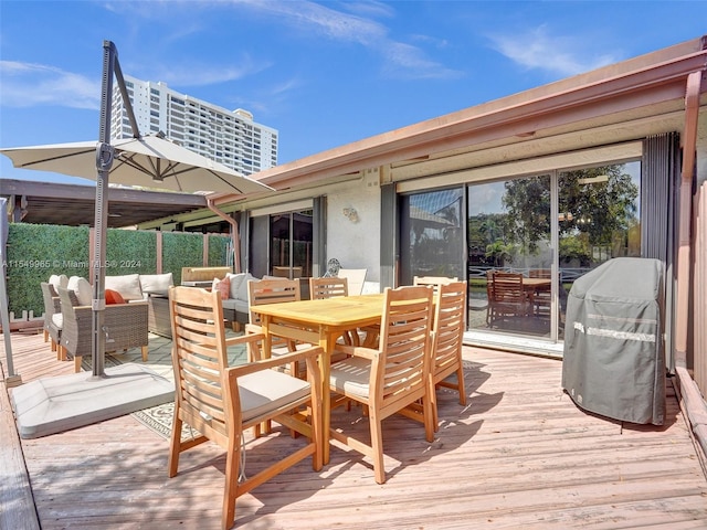 wooden terrace featuring an outdoor living space