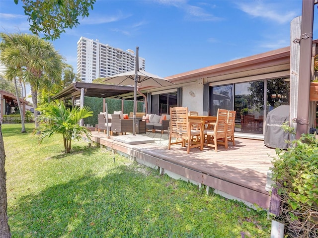 back of property with outdoor lounge area, a wooden deck, and a lawn