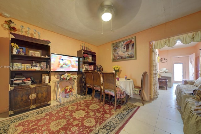 office space featuring ceiling fan and light tile floors