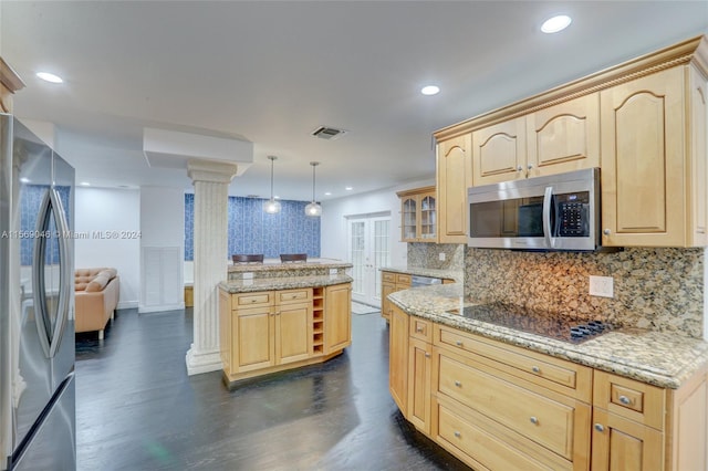 kitchen featuring appliances with stainless steel finishes, tasteful backsplash, light stone countertops, ornate columns, and light brown cabinetry