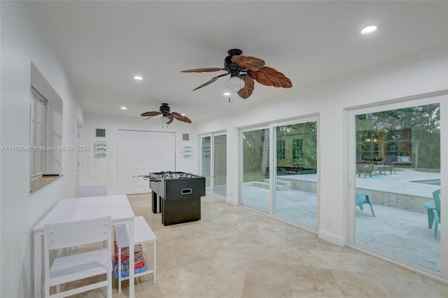 playroom featuring french doors, light tile patterned floors, and ceiling fan