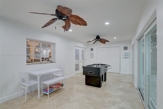 game room with light tile patterned floors, ceiling fan, and french doors