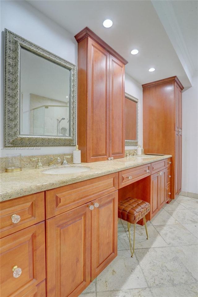 bathroom with tile patterned flooring and dual bowl vanity