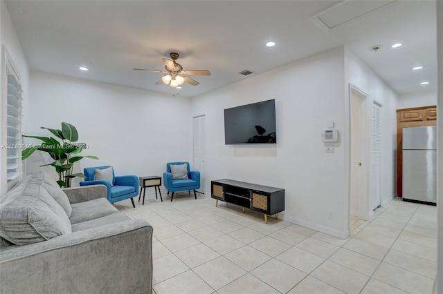 tiled living room with ceiling fan